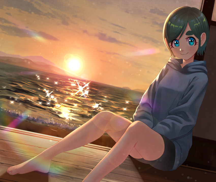 1girl absurdres aqua_eyes backlighting bare_legs barefoot black_shorts blush clouds cloudy_sky foot_out_of_frame futomayu-chan_(sinohira_rin) green_hair grey_hoodie highres hood hood_down hoodie horizon long_sleeves mountain orange_sky original short_hair shorts sinohira_rin sitting sky smile solo sparkle sunset water