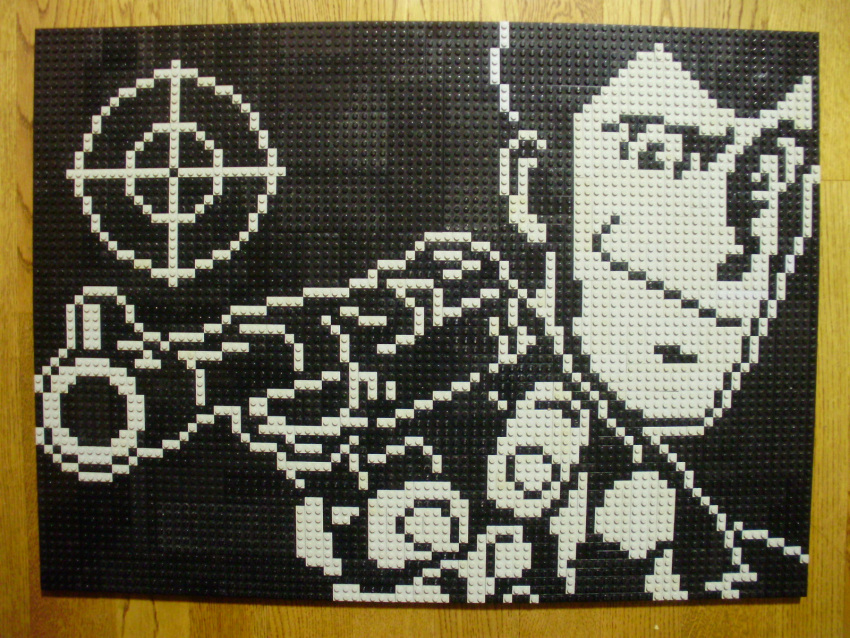 1boy arsene_lupin_iii closed_mouth gun highres holding holding_gun holding_weapon lego lego_(medium) looking_at_viewer lupin_iii male_focus monochrome photo_(medium) pixel_art short_hair solo unconventional_media upper_body weapon you_rei_(blowback)