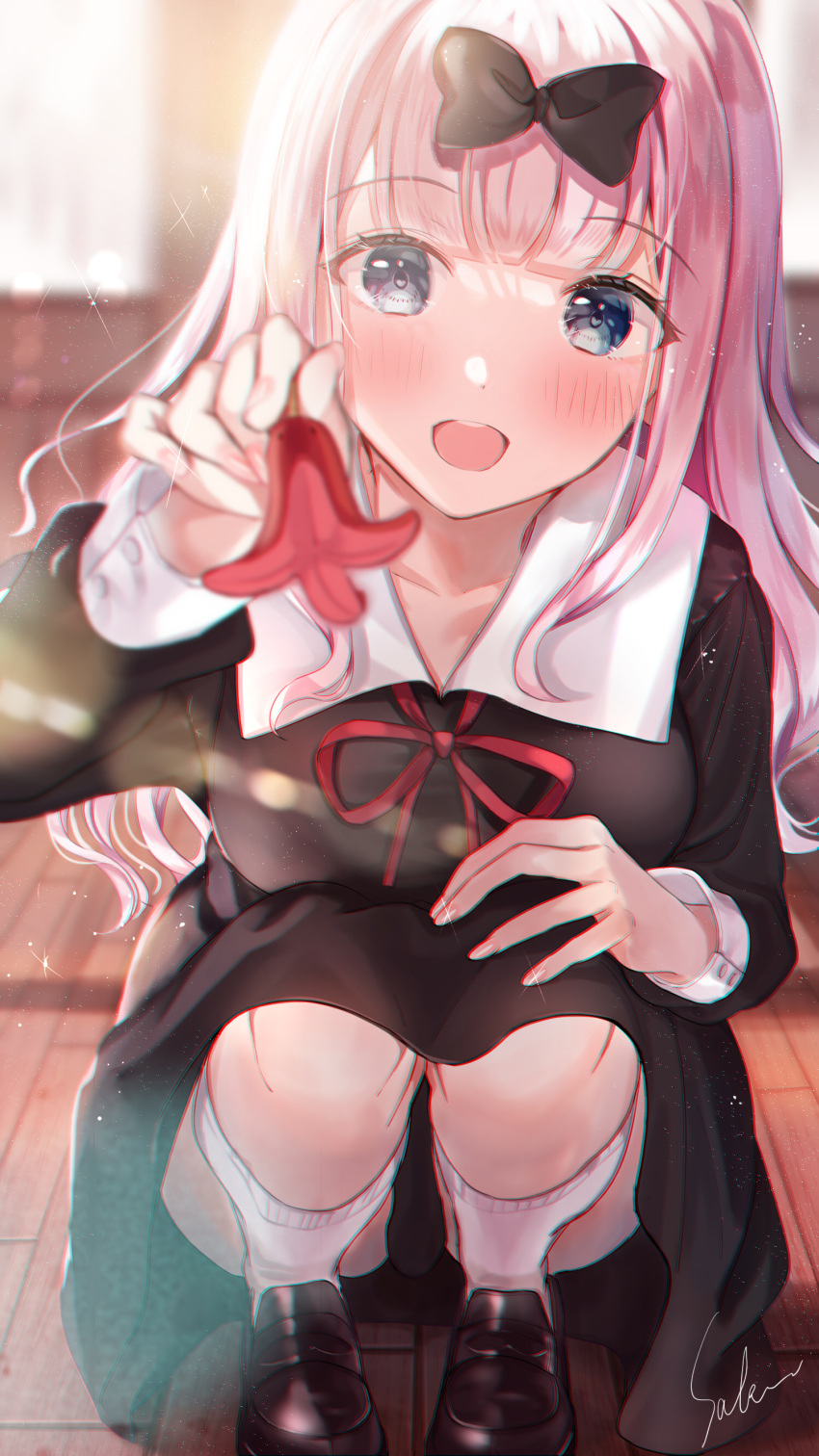 1girl absurdres bangs black_bow black_dress black_footwear blue_eyes blush bow breasts collared_dress dress eyebrows_visible_through_hair food fujiwara_chika hair_bow hand_on_own_knee heart highres holding holding_food indoors kaguya-sama_wa_kokurasetai_~tensai-tachi_no_renai_zunousen~ kneehighs loafers long_hair long_sleeves looking_at_viewer neck_ribbon open_mouth pink_hair red_ribbon ribbon sakura_(39ra) sausage school_uniform shoes shuuchiin_academy_uniform smile solo squatting white_legwear