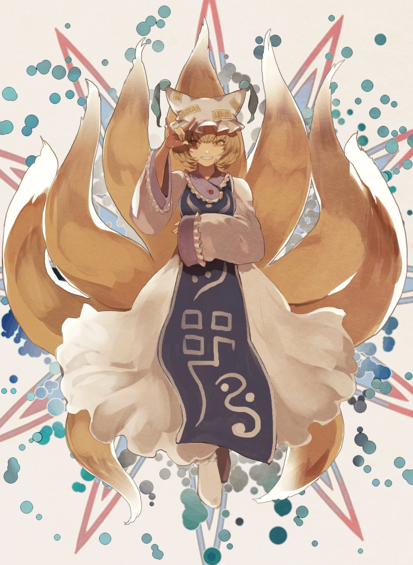1girl beige_background blonde_hair commentary dress fox_shadow_puppet fox_tail frilled_sleeves frills full_body grin hand_up hat highres joniko1110 looking_at_viewer multiple_tails pillow_hat short_hair sleeves_past_wrists smile socks solo tabard tail touhou white_dress white_headwear white_legwear wide_sleeves yakumo_ran yellow_eyes