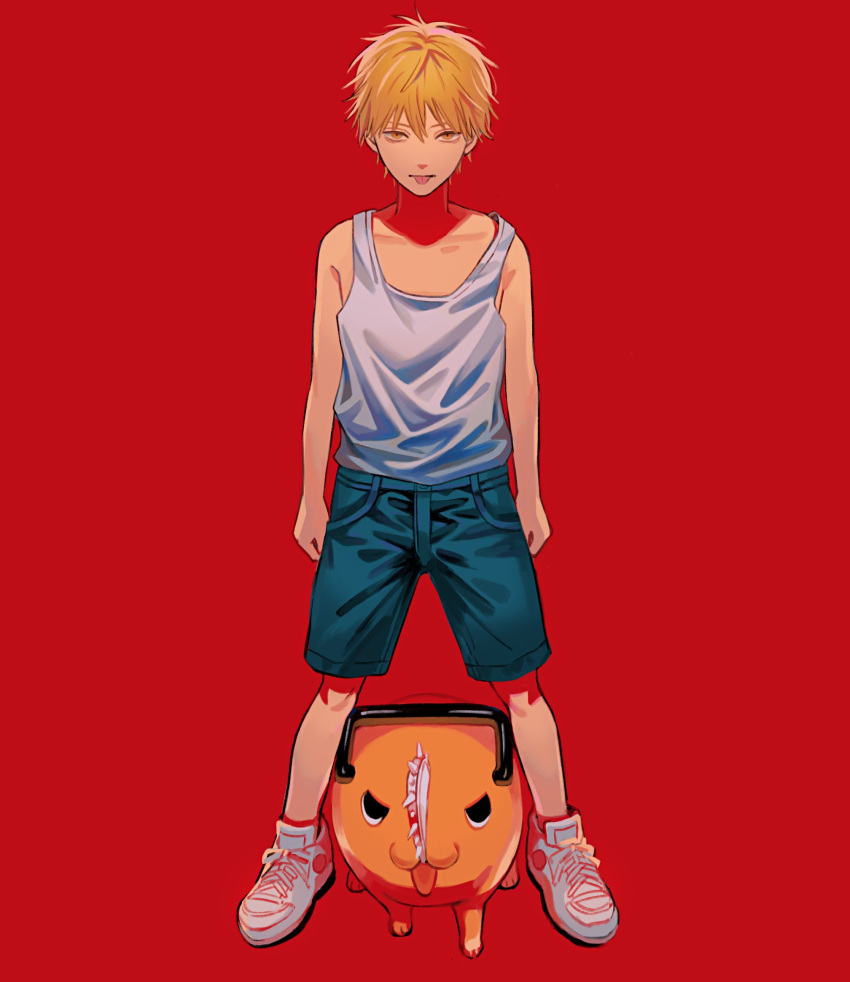 1boy am88121 arms_at_sides bangs bare_arms bare_shoulders black_eyes blonde_hair blue_shorts chainsaw chainsaw_man collarbone commentary_request creature denji_(chainsaw_man) full_body highres legs_apart looking_at_viewer male_focus pochita_(chainsaw_man) red_background shirt_tucked_in shoes short_hair shorts simple_background sneakers standing tank_top tongue tongue_out white_footwear white_tank_top yellow_eyes younger