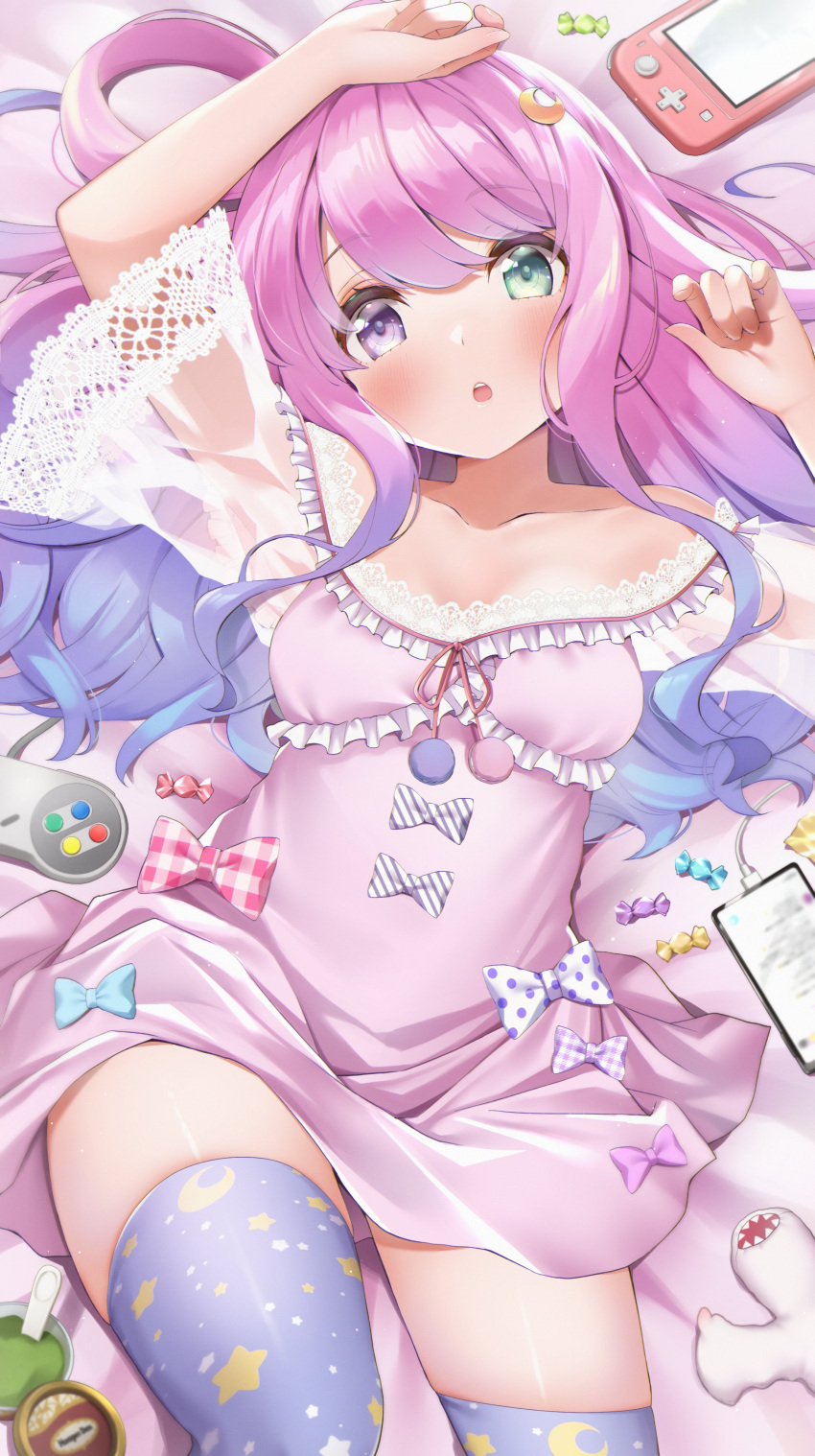 1girl :o absurdres arms_up bangs bare_shoulders bed_sheet blush bow bowtie breasts candy cellphone commentary controller dragon dress eyebrows_behind_hair food game_console game_controller gamepad gradient_hair green_eyes haagen-dazs hair_rings heterochromia highres himemori_luna hololive iphone_x khezu long_hair looking_at_viewer lying makinan monster_hunter_(series) moon_(ornament) multicolored_hair on_back on_bed one_side_up open_mouth phone pink_hair purple_hair see-through skindentation sleepwear small_breasts smartphone solo stuffed_toy super_nintendo thigh-highs translucent_hair violet_eyes virtual_youtuber wavy_hair wii_u_gamepad wyvern zettai_ryouiki