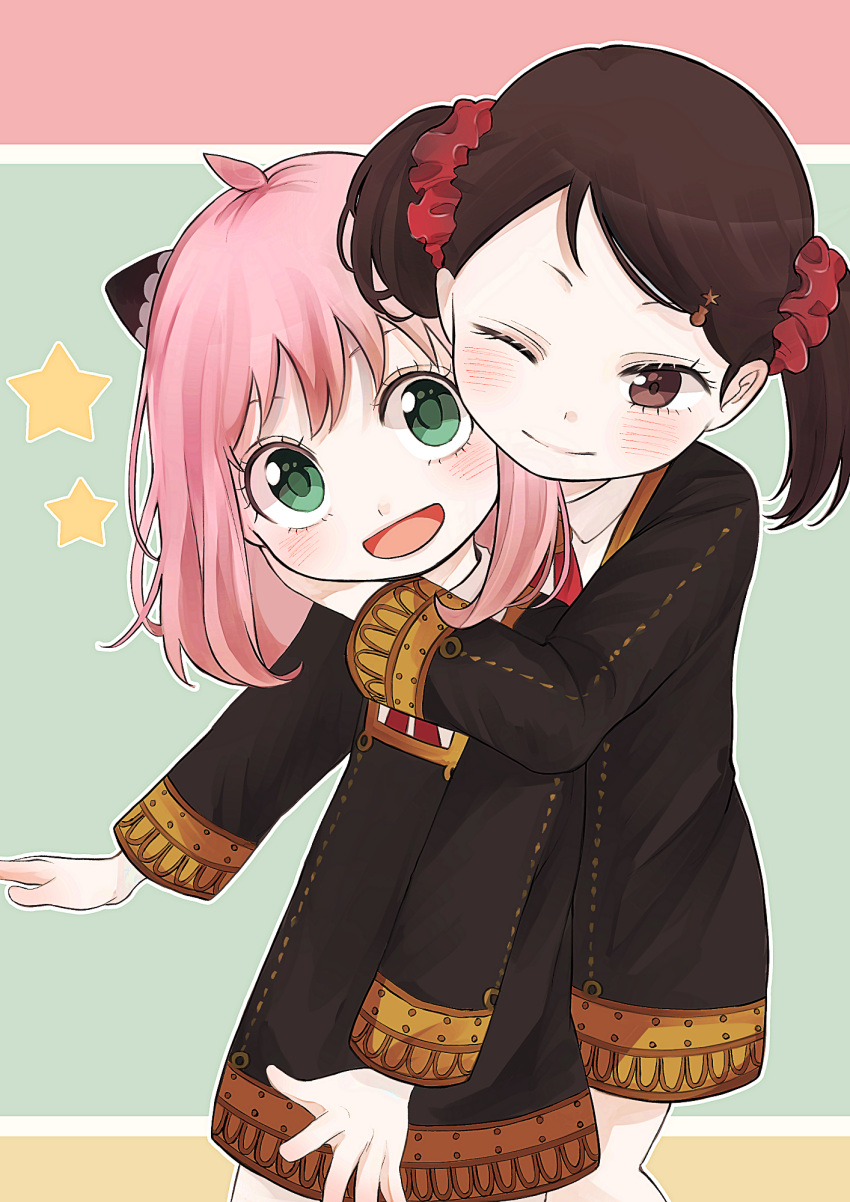 2girls :d ahoge ania_(spy_x_family) bangs becky_blackbell black_dress blush brown_eyes brown_hair child closed_mouth collared_shirt commentary cowboy_shot dress eyelashes green_background green_eyes hair_ornament hairclip highres horn_ornament horns hug hug_from_behind long_sleeves looking_at_viewer medium_hair multiple_girls neck_ribbon one_eye_closed open_mouth parted_bangs pink_background pink_hair red_neckwear ribbon scrunchie shirt simple_background smile spy_x_family star_(symbol) star_hair_ornament toukaairab twintails uniform white_shirt yellow_background
