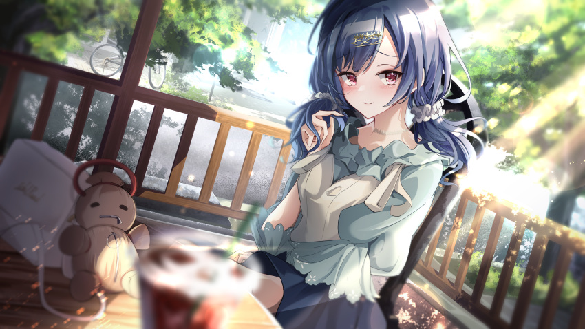 1girl absurdres bag bangs blue_hair blue_shirt blue_skirt blurry blurry_foreground blush commentary_request cup day depth_of_field doll drinking_straw eyebrows_visible_through_hair hand_up highres holding holding_hair idolmaster idolmaster_shiny_colors long_hair looking_at_viewer morino_rinze odecono3 on_chair red_eyes scrunchie shirt short_sleeves sitting skirt solo sunlight swept_bangs table tree twintails