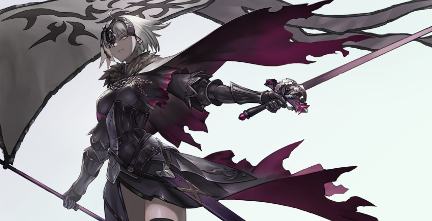 1girl ahoge armor armored_dress bangs banner black_legwear breasts cape dress eyebrows_visible_through_hair fate/grand_order fate_(series) from_below fur-trimmed_cape fur_trim headpiece highres holding holding_sword holding_weapon jeanne_d'arc_(alter)_(fate) jeanne_d'arc_(fate)_(all) looking_at_viewer looking_down medium_breasts nalai scowl sheath short_dress short_hair silver_hair simple_background solo sword thigh-highs torn_clothes weapon white_background yellow_eyes