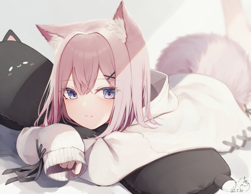 1girl animal_ear_fluff animal_ears bangs blue_eyes blurry blurry_background blush brown_hair cat_pillow closed_mouth commentary_request dated depth_of_field eyebrows_visible_through_hair hair_between_eyes hair_ornament hairclip highres hood hood_down hoodie long_sleeves looking_at_viewer lying mayogii on_stomach original pillow pillow_hug signature sleeves_past_fingers sleeves_past_wrists smile solo tail white_hoodie x_hair_ornament