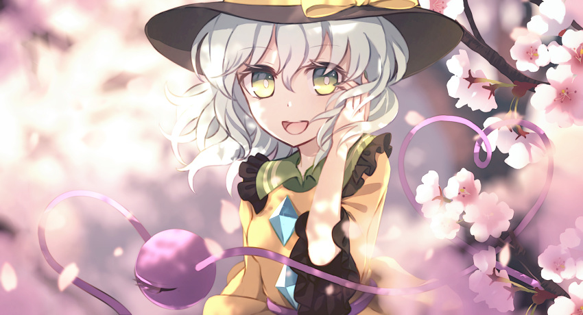 1girl bangs blouse bow branch breasts buttons cherry_blossoms collared_blouse commentary_request crystal dise eyebrows_visible_through_hair eyes_visible_through_hair flower frills green_eyes grey_hair grey_headwear hair_between_eyes hand_up hat hat_bow highres jewelry komeiji_koishi light long_sleeves looking_to_the_side medium_breasts open_mouth petals pink_flower shadow short_hair smile solo sunlight teeth third_eye tongue touhou tree upper_body wide_sleeves yellow_blouse yellow_bow