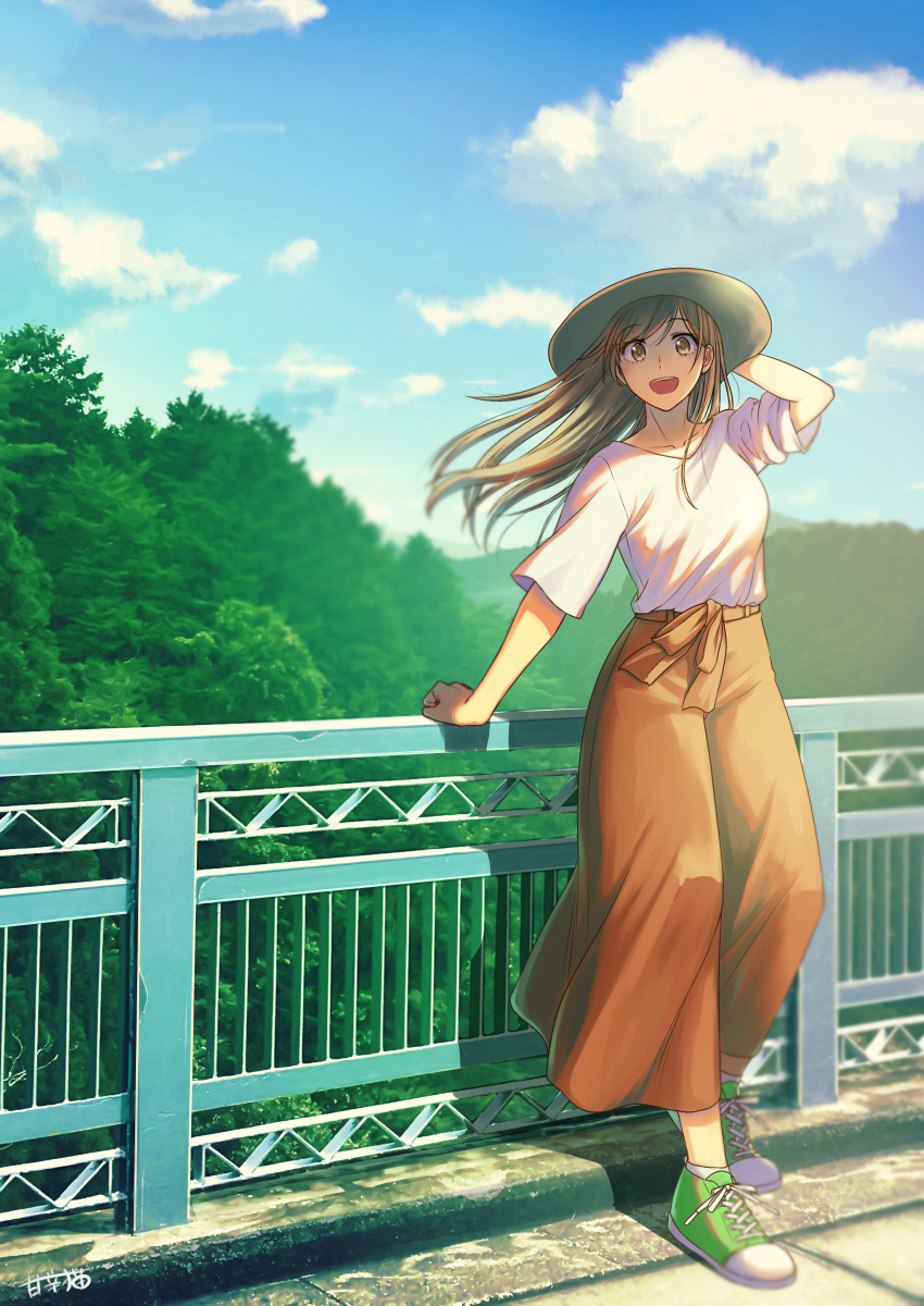 1girl absurdres arm_behind_head blouse blue_sky blurry blurry_background brown_eyes brown_hair brown_skirt clouds collarbone commentary_request day eyebrows_visible_through_hair full_body green_footwear hair_blowing hat highres leaning_on_rail long_hair long_skirt looking_at_viewer open_mouth original outdoors railing raito_(latek) shoes short_sleeves skirt sky smile sneakers solo standing sun_hat tree upper_teeth white_blouse