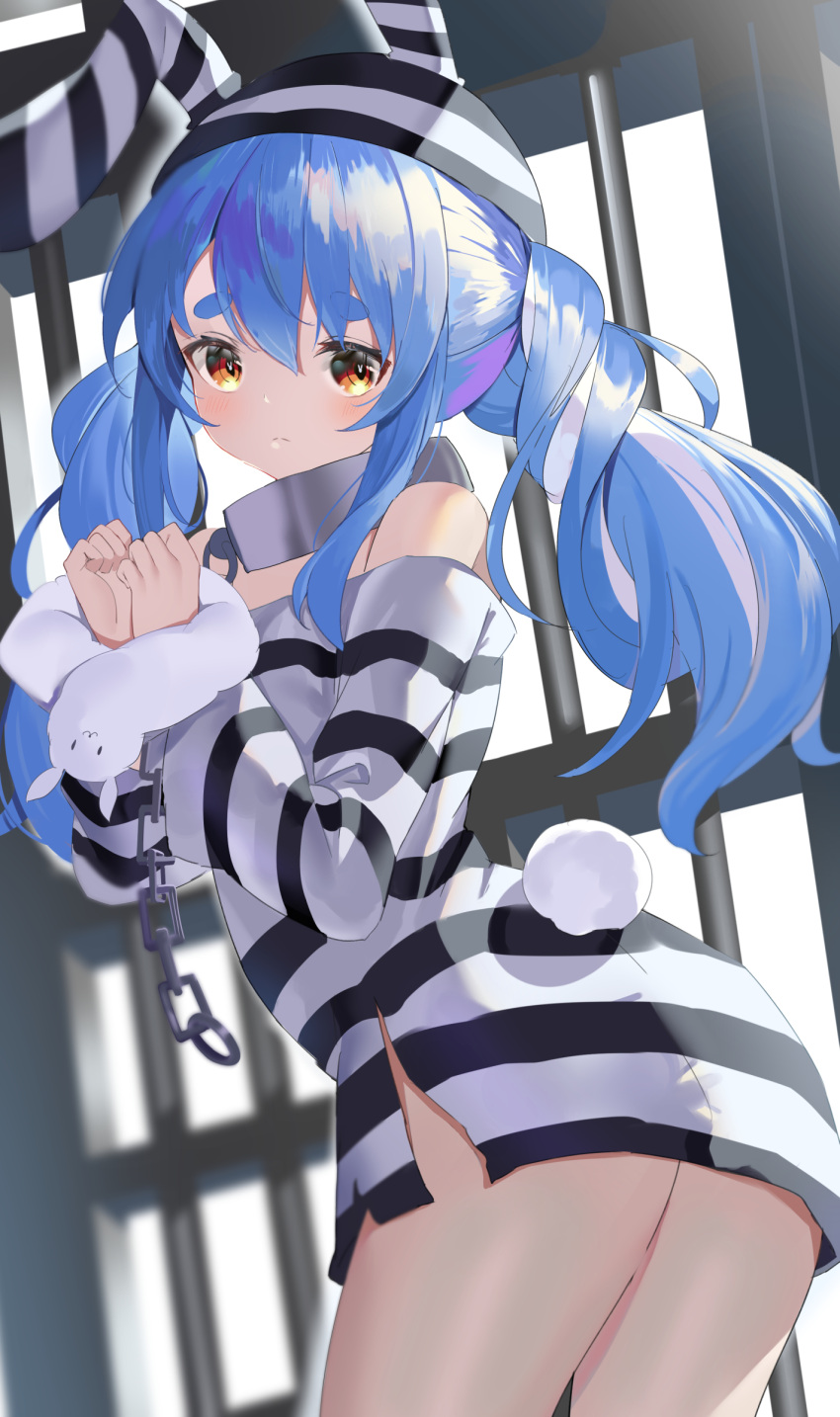 1girl absurdres animal_ears bare_shoulders blue_hair blush breasts bunny-shaped_pupils bunny_tail chain cowboy_shot cuffs don-chan_(usada_pekora) from_behind frown handcuffs highres hikimayu hololive leaning_forward long_hair looking_at_viewer messy_hair multicolored_hair orange_eyes prison_cell prison_clothes prisoner rabbit_ears rabbit_girl sad shackles small_breasts solo tail thick_eyebrows torn_clothes tsukise_miwa twintails twisted_torso two-tone_hair usada_pekora white_hair