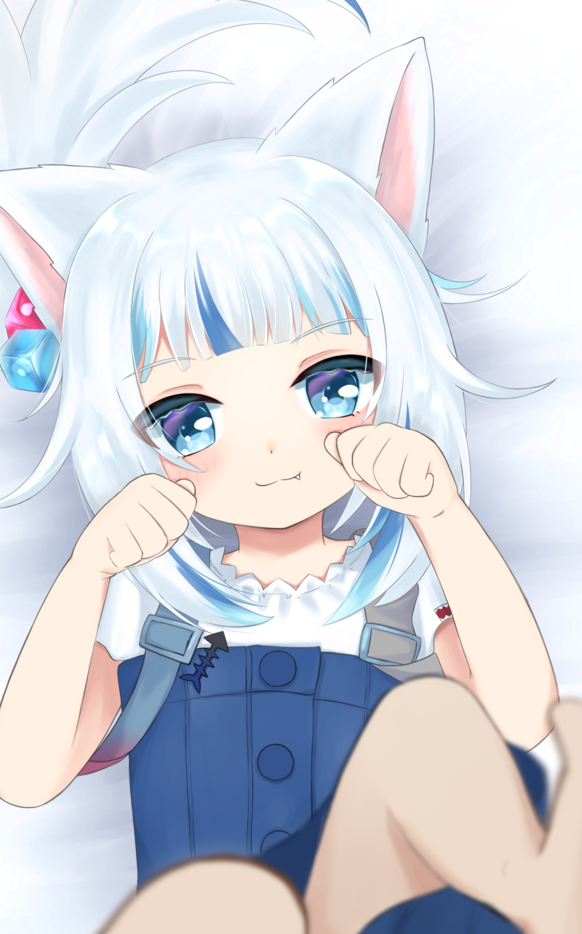 1girl absurdres animal_ears bangs blue_eyes blue_hair blunt_bangs blurry blush cat_ears child commentary english_commentary eyebrows_visible_through_hair fang fang_out gawr_gura highres hololive hololive_english jagaimonojaga legs light_blue_hair long_hair looking_at_viewer multicolored_hair nyan overalls paw_pose shirt smile streaked_hair virtual_youtuber white_hair white_shirt younger