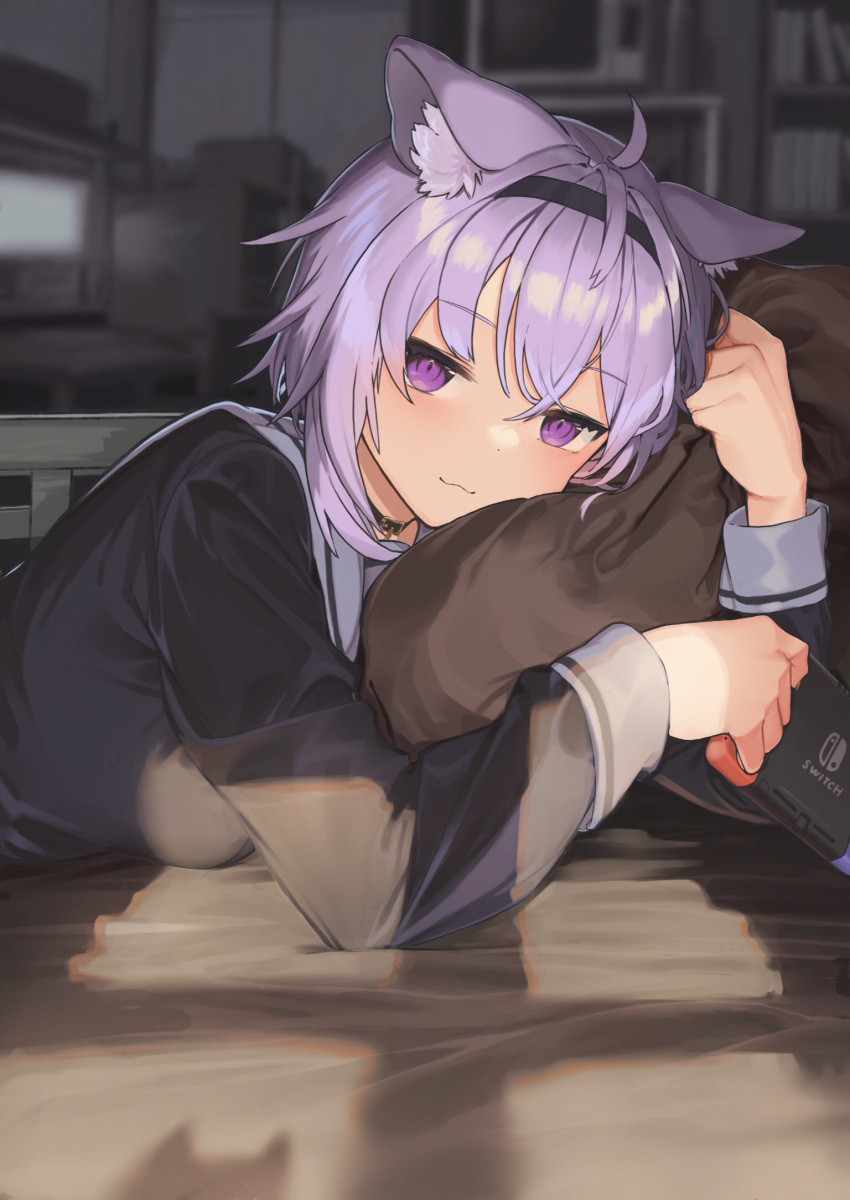 1girl :3 ahoge animal_ear_fluff animal_ears black_choker black_shirt blurry blurry_background blush breasts cat_ears cat_girl choker closed_mouth commentary eyebrows_visible_through_hair hair_between_eyes hairband highres hololive indoors light_purple_hair long_sleeves looking_at_viewer lying medium_breasts nekomata_okayu nintendo_switch on_bed on_stomach pillow pillow_hug sailor_collar school_uniform serafuku shirokuma_1231 shirt short_hair smile solo sunlight symbol_commentary upper_body violet_eyes virtual_youtuber