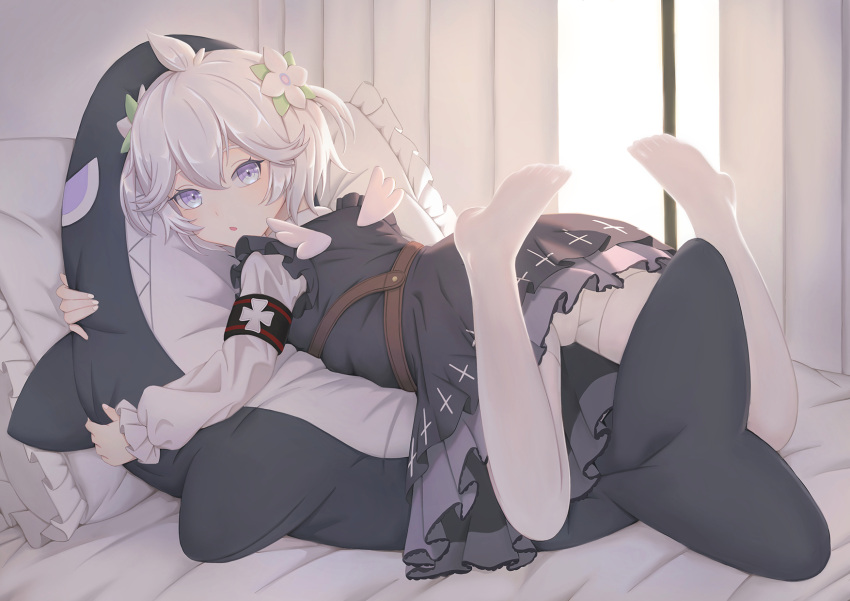 1girl azur_lane belt black_dress blue_eyes brown_belt dress fat123 flower frilled_pillow frills full_body hair_flower hair_ornament highres holding holding_toy indoors looking_at_viewer looking_to_the_side lying mini_wings official_alternate_costume on_bed on_stomach pillow short_hair solo stuffed_animal stuffed_shark stuffed_toy toy u-110_(azur_lane) u-110_(shark's_dreamland)_(azur_lane) white_flower white_hair wings