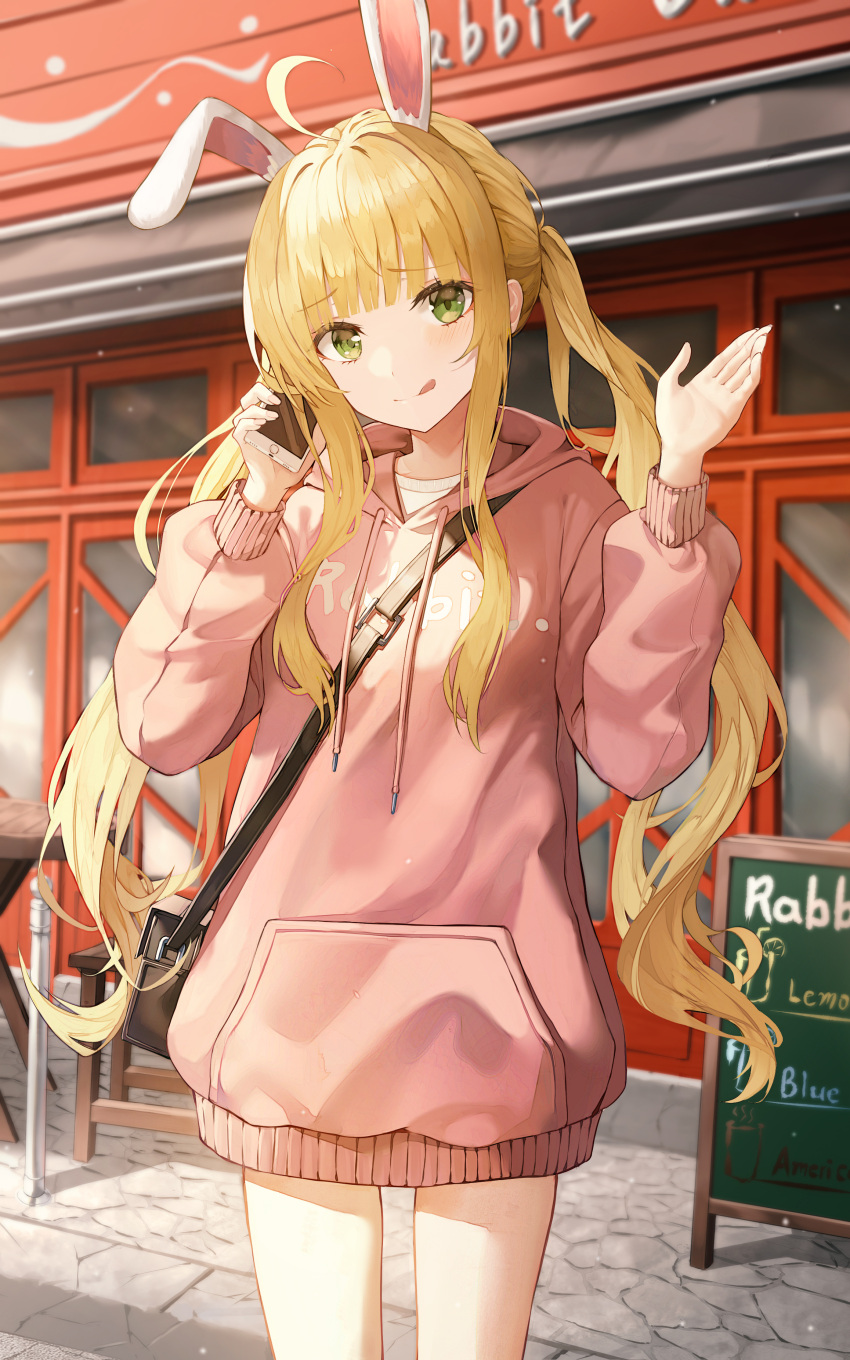 1girl :q absurdres ahoge animal_ears bag bangs blonde_hair building cellphone chair closed_mouth commentary drawstring english_commentary english_text eyebrows_visible_through_hair green_eyes hands_up highres holding holding_phone hood hood_down hoodie kerno long_sleeves looking_at_viewer menu_board original phone pink_hoodie puffy_long_sleeves puffy_sleeves rabbit_ears revision shoulder_bag sidelocks smile solo table tongue tongue_out twintails