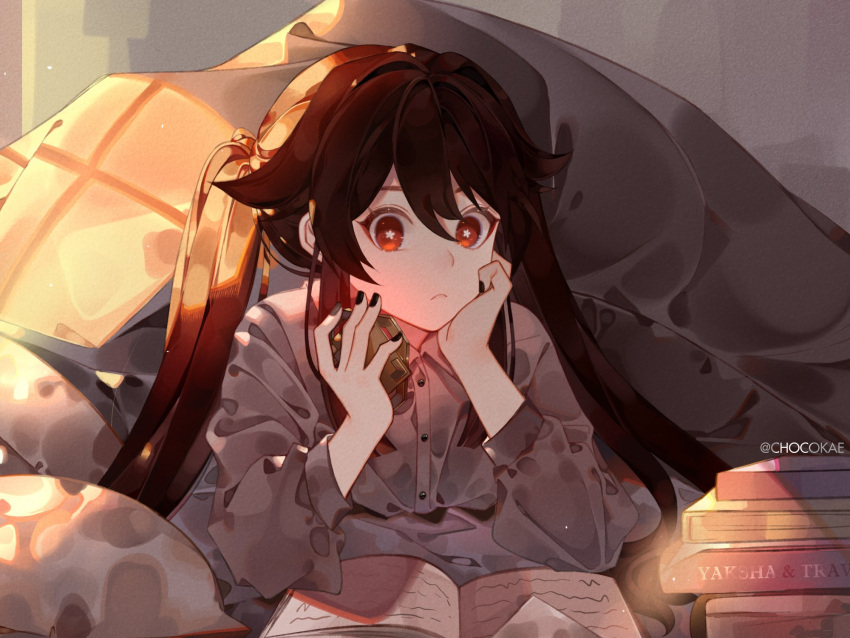 1girl bangs black_nails book brown_hair chocokae closed_mouth collared_shirt commentary english_commentary flower-shaped_pupils genshin_impact highres holding hu_tao_(genshin_impact) long_hair long_sleeves nail_polish open_book red_eyes shirt solo symbol-shaped_pupils twintails under_covers vision_(genshin_impact)