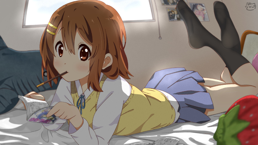 1girl absurdres bangs black_legwear blue_neckwear blue_skirt blush book brown_eyes brown_hair closed_mouth commentary_request eyebrows_visible_through_hair food food_in_mouth full_body hair_between_eyes hair_ornament hairclip highres hirasawa_yui indoors k-on! kneehighs long_sleeves looking_at_viewer lying manga_(object) medium_hair motchi001 neck_ribbon on_bed on_stomach photo_(object) pocky reading ribbon sakuragaoka_high_school_uniform school_uniform shirt skirt solo strawberry_pillow sweater_vest white_shirt yellow_sweater_vest