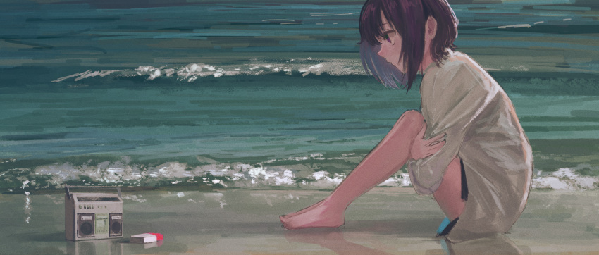 1girl bangs bare_legs barefoot beach black_shorts cigarette_pack commentary daruma_karei from_side highres hugging_own_legs looking_away ocean original outdoors profile purple_hair radio shirt short_hair shorts sitting solo violet_eyes waves white_shirt