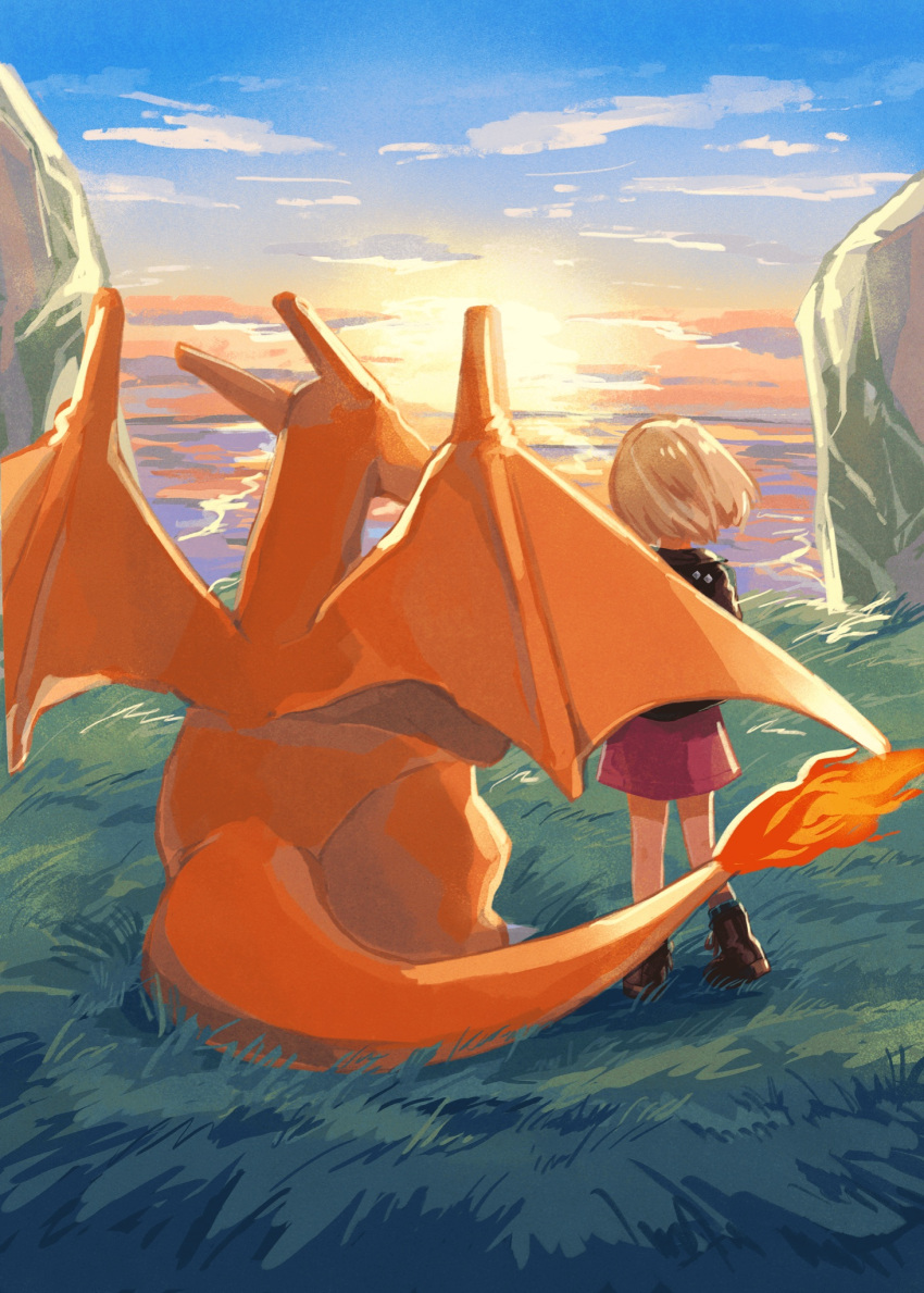 1girl blonde_hair boots brown_footwear charizard clouds day dress fire flame from_behind gen_1_pokemon grass highres jacket mo~zu outdoors pokemon pokemon_(creature) purple_dress shiny shiny_hair short_hair sky standing sunset symbol_commentary