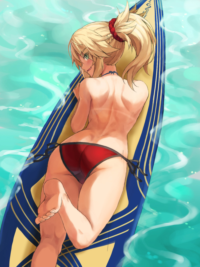 1girl ass back bangs bare_shoulders bikini blonde_hair braid breasts fate/grand_order fate_(series) french_braid green_eyes hair_ornament hair_scrunchie highres long_hair looking_at_viewer looking_back mordred_(fate)_(all) mordred_(swimsuit_rider)_(fate) open_mouth parted_bangs ponytail prydwen_(fate) red_bikini scrunchie sidelocks small_breasts smile solo surfboard swimsuit tonee water