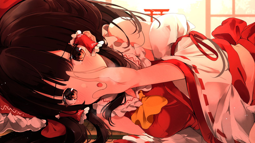 :o ascot bangs blush bow breasts breath brown_eyes brown_hair detached_sleeves eyebrows_visible_through_hair frilled_bow frilled_shirt_collar frills hair_bow hair_tubes hakurei_reimu hand_on_own_face highres hunya long_hair looking_at_viewer lying midriff on_side open_mouth red_bow red_ribbon red_shirt red_skirt ribbon ribbon-trimmed_sleeves ribbon_trim shirt shrine sidelocks skirt sunlight torii touhou whispering wide_sleeves yellow_neckwear