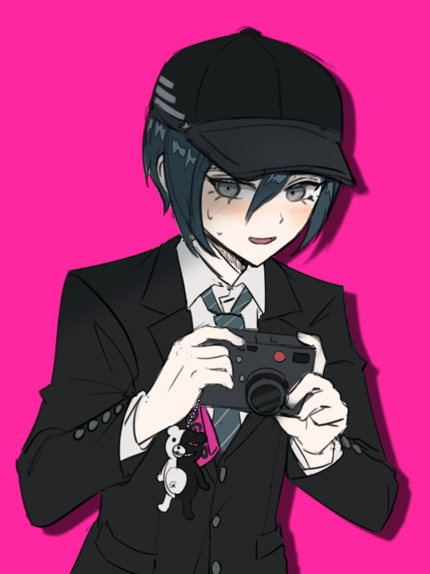 1boy ahoge bangs black_hair black_headwear black_jacket blush camera charm_(object) collared_shirt commentary_request dangan_ronpa_(series) dangan_ronpa_v3:_killing_harmony highres holding holding_camera jacket japduk_s2 long_sleeves male_focus monokuma open_mouth pink_background saihara_shuuichi shirt short_hair simple_background solo striped striped_neckwear upper_body white_shirt