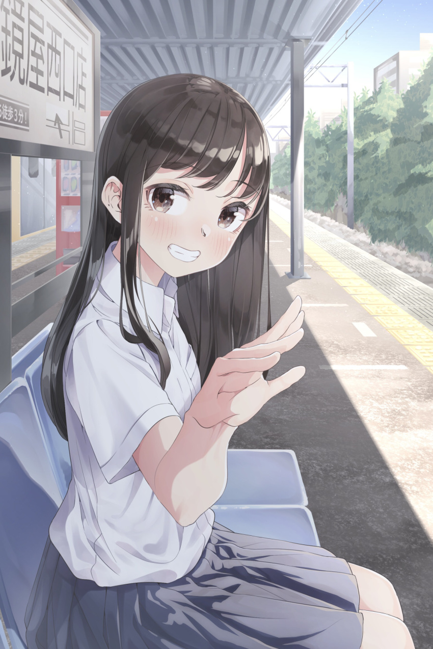 12_graka 1girl bangs bench black_hair black_skirt blush brown_eyes building day hand_up highres long_hair original outdoors power_lines school_uniform shirt short_sleeves sitting skirt smile solo train_station uniform white_shirt