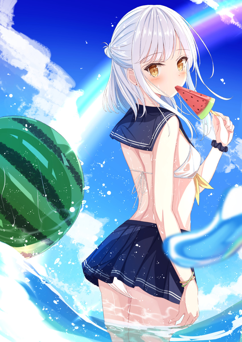 1girl bare_back bareback bikini blue_sky blurry bracelet clouds cloudy_sky commentary_request depth_of_field eating eyebrows_visible_through_hair food from_behind fruit highres holding holding_food in_water jewelry long_hair looking_at_viewer looking_back midriff ocean original pleated_skirt popsicle scrunchie senri_(senri_sen) sidelocks skirt sky solo swimsuit water_drop watermelon wet wet_clothes wet_swimsuit white_bikini white_hair wrist_scrunchie yellow_eyes