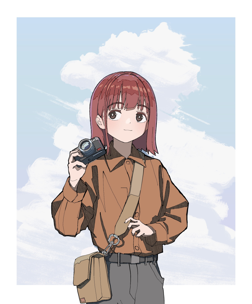 1girl absurdres bag bangs blue_sky border breasts brown_eyes camera closed_mouth clouds collared_shirt commentary eyebrows_visible_through_hair grey_pants hand_up highres holding holding_camera light_smile ligne_claire long_sleeves medium_hair orange_shirt original pants redhead satchel shirt shunken_he sky solo white_border