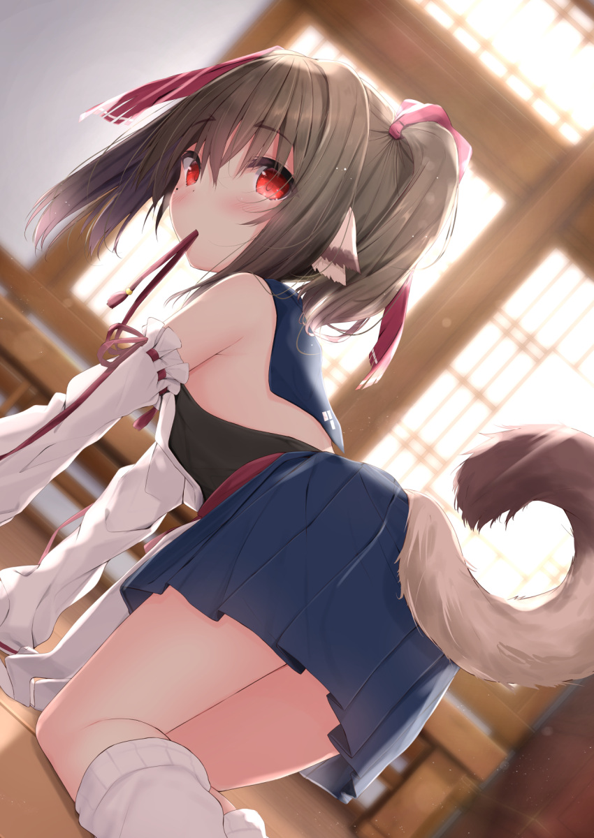 1girl all_fours bangs bare_shoulders blue_skirt blurry blurry_background blush bow brown_hair commentary_request copyright_request depth_of_field detached_sleeves dutch_angle eyebrows_visible_through_hair feet_out_of_frame hair_between_eyes hair_bow highres indoors kouda_suzu looking_at_viewer looking_back loose_socks mouth_hold pleated_skirt red_bow red_eyes skirt socks solo tail_raised twintails white_legwear white_sleeves
