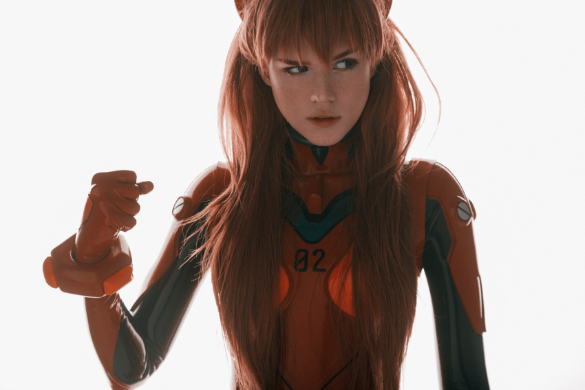 1girl absurdres blue_eyes bodysuit brown_hair clenched_hand cosplay film_grain freckles hair_over_breasts highres long_hair neon_genesis_evangelion photo_(medium) plugsuit red_bodysuit reference_photo shirogane-sama sideways_glance simple_background solo souryuu_asuka_langley upper_body white_background