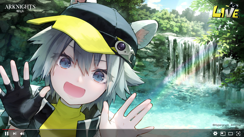 1girl :d animal_ears arknights baseball_cap black_gloves black_headwear black_jacket blue_eyes click_(arknights) commentary company_name copyright_name ears_through_headwear english_commentary fake_screenshot gloves grey_hair hair_between_eyes hands_up hat highres jacket looking_at_viewer mouse_ears official_art official_wallpaper open_mouth outdoors plant portrait rainbow shirt short_hair single_glove smile solo syuri22 water waterfall watermark yellow_shirt