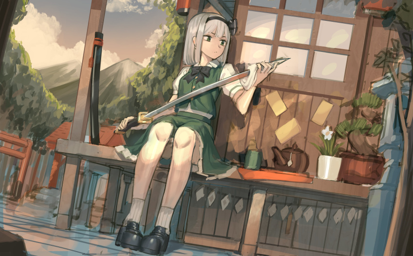1girl absurdres architecture black_bow black_footwear black_hairband black_neckwear bow bowtie clouds commentary cup dutch_angle east_asian_architecture flower goback green_eyes green_shirt green_skirt grey_hair hair_bow hairband highres holding holding_sword holding_weapon huge_filesize konpaku_youmu mountain outdoors plant polishing potted_plant scabbard sheath shirt shoes sitting skirt sky socks solo sword teapot touhou weapon white_flower white_legwear window