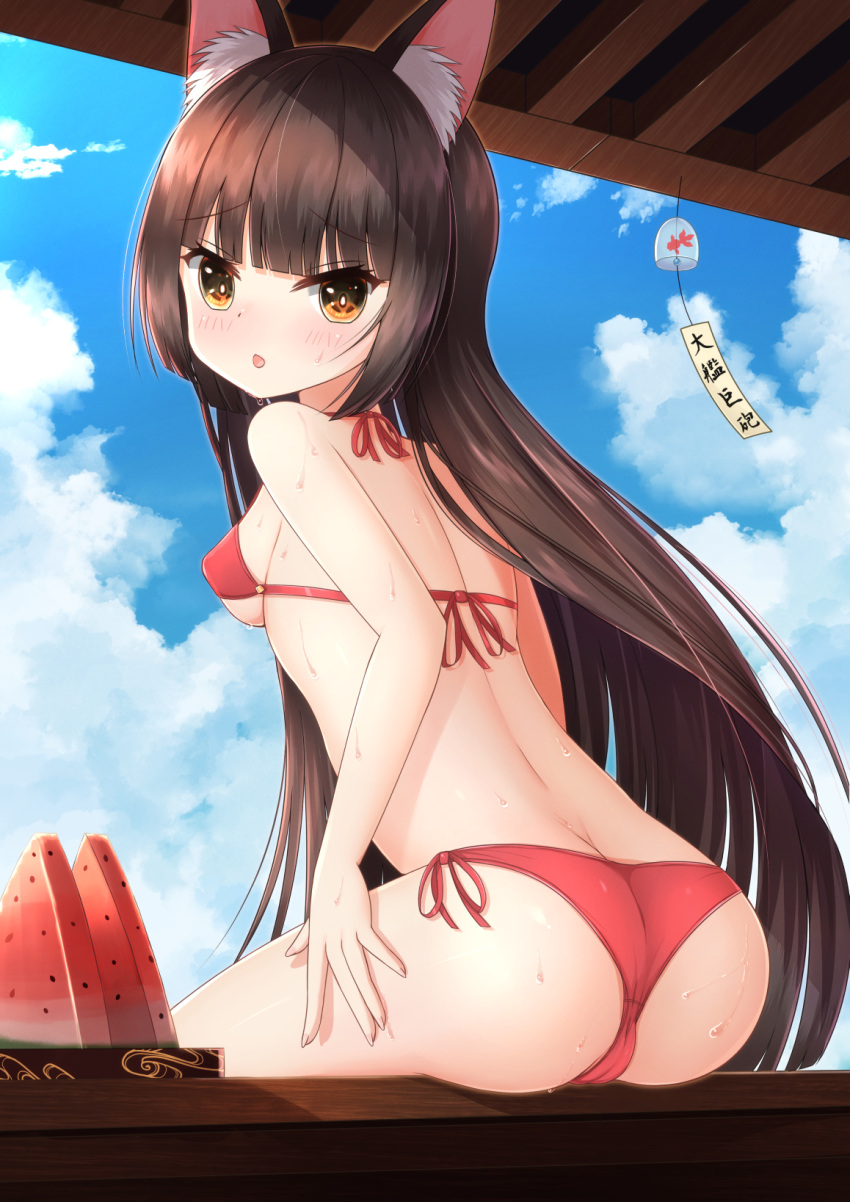 1girl animal_ear_fluff animal_ears ass azur_lane bangs bikini blunt_bangs breasts brown_eyes brown_hair butt_crack clouds food fox_ears from_behind fruit hand_on_own_thigh highres long_hair looking_at_viewer looking_back nagato_(azur_lane) nc731 open_mouth outdoors red_bikini side-tie_bikini sideboob sitting sky small_breasts solo sweat swimsuit very_long_hair watermelon wind_chime