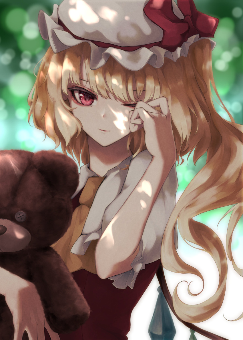 1girl absurdres ascot bangs blonde_hair blurry blurry_background bokeh bow closed_mouth commentary_request crystal depth_of_field expressionless eyebrows_behind_hair flandre_scarlet hand_up hat hat_bow highres holding holding_stuffed_toy looking_at_viewer mizuhichi mob_cap one_eye_closed one_side_up puffy_short_sleeves puffy_sleeves red_bow red_vest rubbing_eyes short_hair short_sleeves solo stuffed_animal stuffed_toy teddy_bear touhou upper_body vest white_headwear wings yellow_neckwear