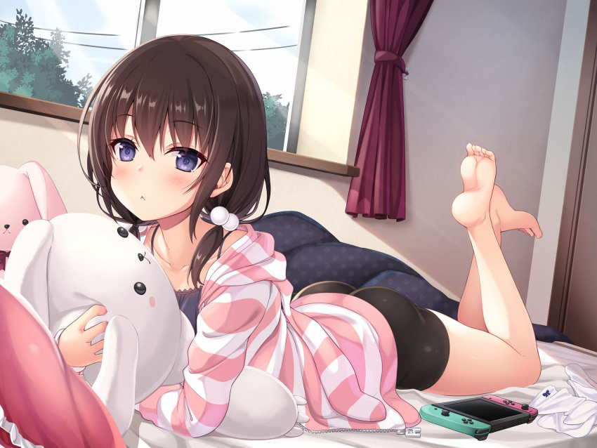 1girl :&lt; ass bangs bare_shoulders bed_sheet bike_shorts black_camisole black_shorts blanket brown_hair camisole collarbone curtains eyebrows_visible_through_hair feet feet_up hair_between_eyes hair_bobbles hair_ornament highres holding hood hoodie indoors light_rays looking_at_viewer lying medium_hair nintendo_switch object_hug on_bed on_stomach original pillow power_lines short_twintails shorts socks socks_removed solo striped striped_hoodie stuffed_animal stuffed_bunny stuffed_toy sunbeam sunlight toes tree twintails utsurogi_akira violet_eyes white_legwear window