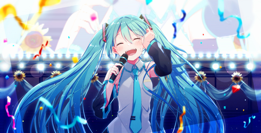 1girl aqua_eyes aqua_hair aqua_neckwear asagao_minoru bangs black_sleeves blush detached_sleeves flower hair_flower hair_ornament hatsune_miku highres holding holding_microphone long_hair microphone necktie open_mouth smile solo sunflower_hair_ornament twintails very_long_hair vocaloid