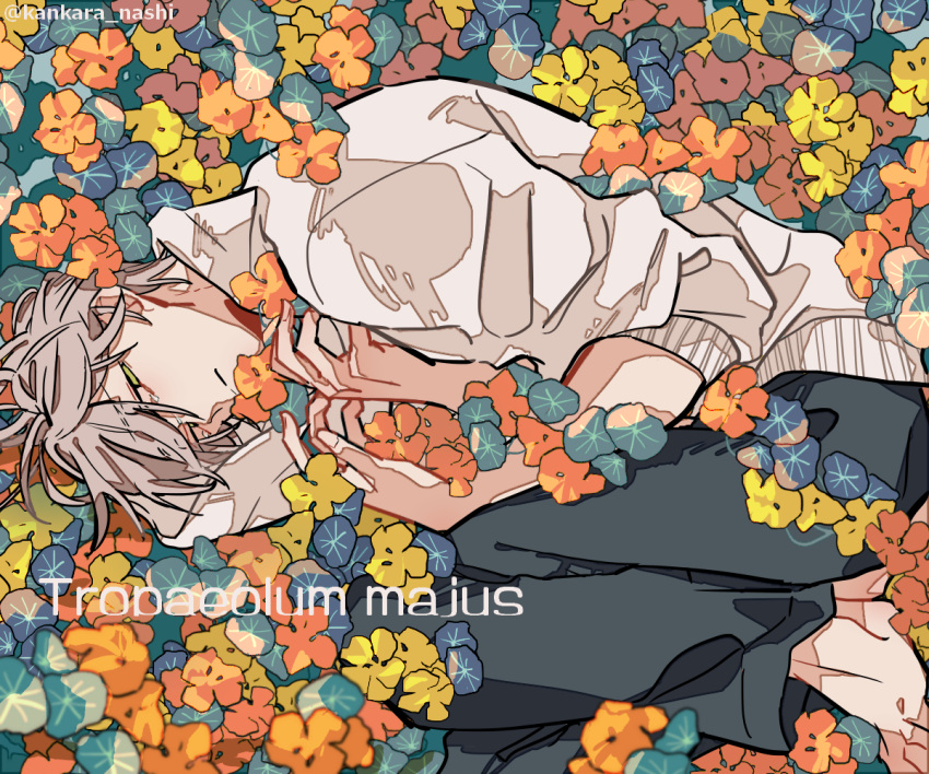1boy barefoot black_pants blue_flower closed_mouth commentary_request fetal_position flower green_eyes grey_hair half-closed_eyes hands_on_own_chest kankara_nashi latin_text lying male_focus nasturtium on_side orange_flower original pants short_hair sleeves_rolled_up solo sweater twitter_username white_sweater yellow_flower
