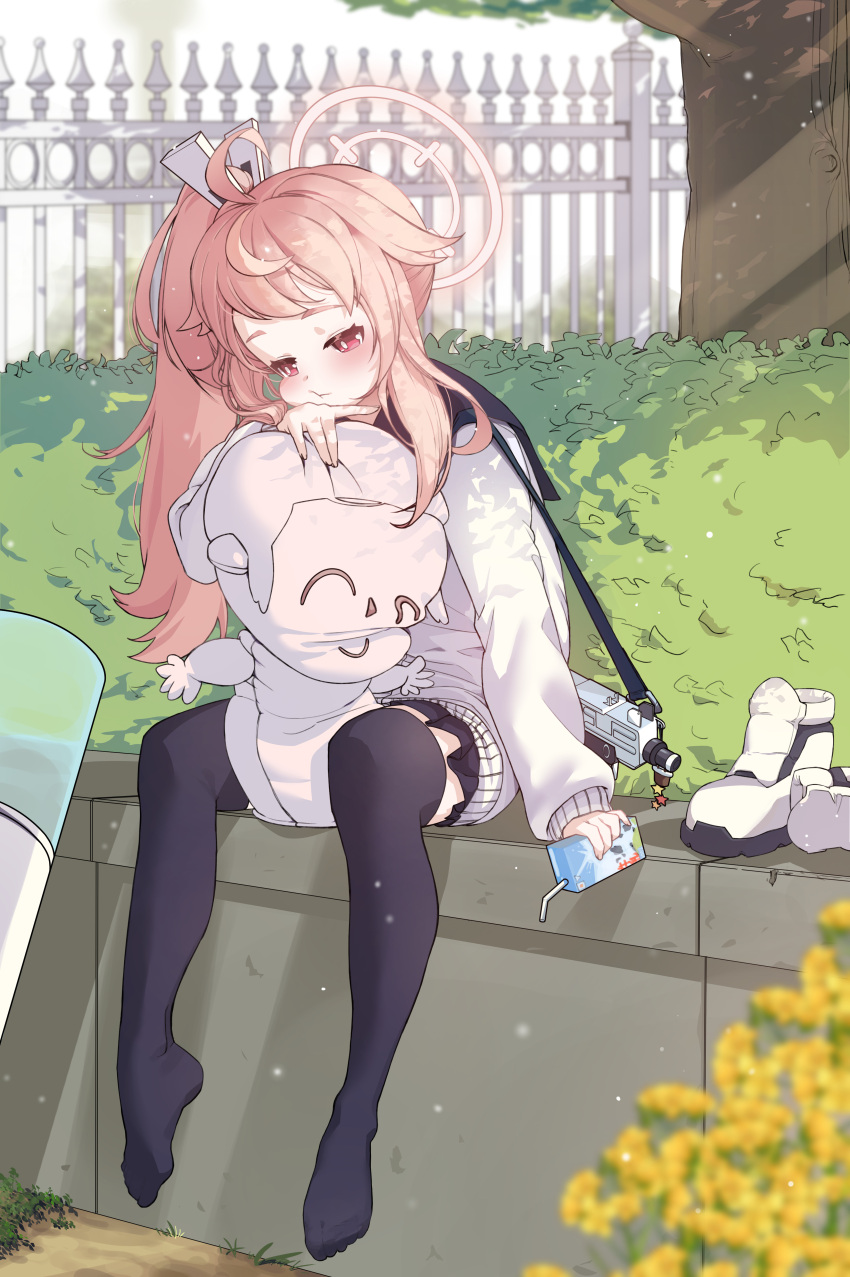 1girl :t absurdres ahoge black_skirt black_thighhighs blonde_hair blue_archive cheek_squash chjune119 commentary day doll_hug drink fence flower full_body gun halo hedge highres holding holding_drink juice_box long_sleeves miniskirt natsu_(blue_archive) object_hug outdoors red_eyes shoes shoes_removed side_ponytail sitting skirt sleeves_past_wrists solo stuffed_toy sunlight sweater thigh-highs tree weapon weapon_request white_footwear white_sweater