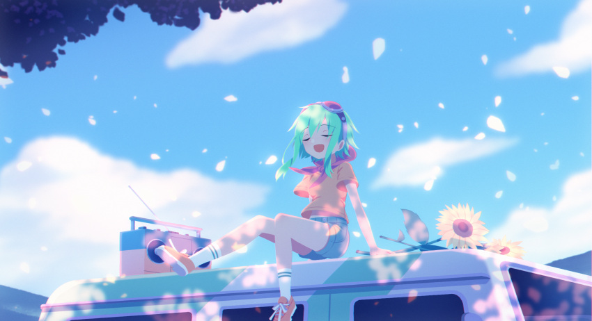 1girl car closed_eyes flower goggles goggles_on_head green_hair ground_vehicle gumi highres motor_vehicle open_mouth outdoors radio red-tinted_eyewear red_goggles sakakidani short_hair_with_long_locks short_sleeves shorts sitting solo sunflower tinted_eyewear vocaloid