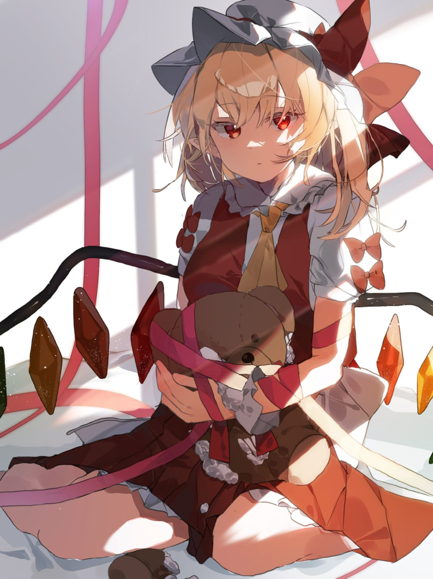 1girl ascot blonde_hair breasts broken crystal eyebrows_visible_through_hair flandre_scarlet frilled_shirt_collar frills gominami hair_between_eyes hat hat_ribbon highres looking_at_viewer medium_breasts mob_cap ribbon shirt short_hair short_sleeves side_ponytail sitting solo stuffed_animal stuffed_toy sunlight teddy_bear touhou vampire white_shirt wings yellow_neckwear