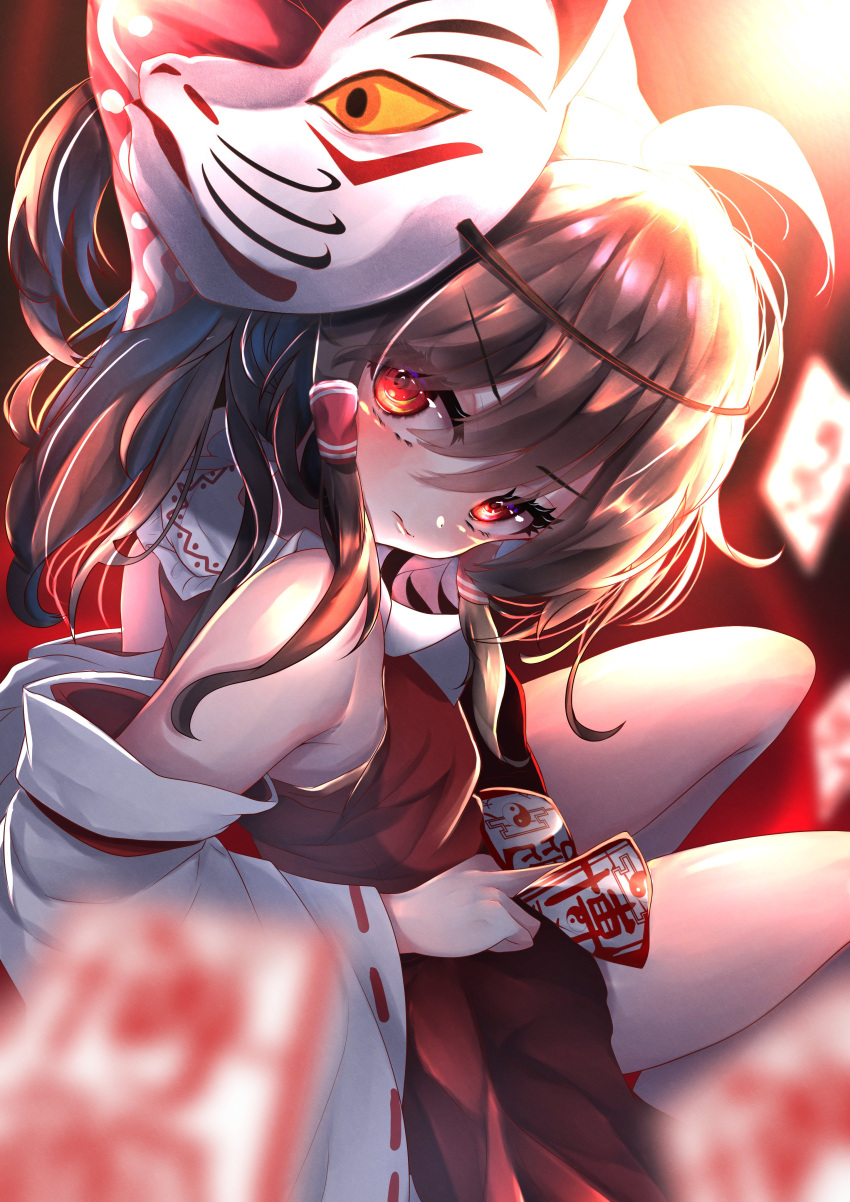 1girl absurdres bangs blurry blurry_foreground brown_hair closed_mouth detached_sleeves dfra eyebrows_visible_through_hair fox_mask hair_tubes hakurei_reimu highres holding light looking_at_viewer mask mask_on_head medium_hair nontraditional_miko ofuda red_eyes red_shirt red_skirt ribbon-trimmed_sleeves ribbon_trim shirt skirt solo touhou v-shaped_eyebrows wide_sleeves