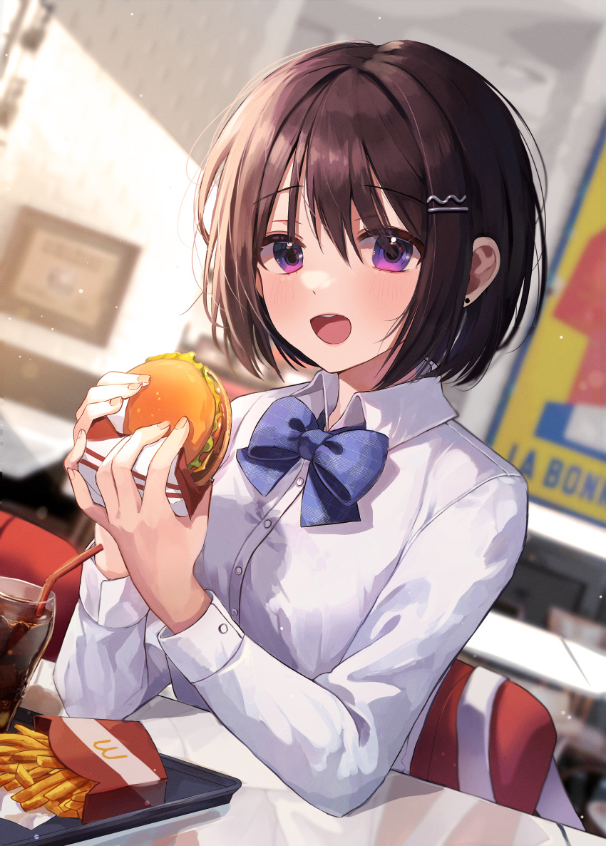 1girl absurdres bangs black_hair blue_bow blue_neckwear blurry blurry_background blush bow bowtie burger chair cola collared_shirt cup dress_shirt food french_fries hair_ornament hairclip highres holding holding_food huge_filesize indoors long_sleeves looking_at_viewer myowa open_mouth original school_uniform shirt short_hair sitting smile soda solo table violet_eyes white_shirt