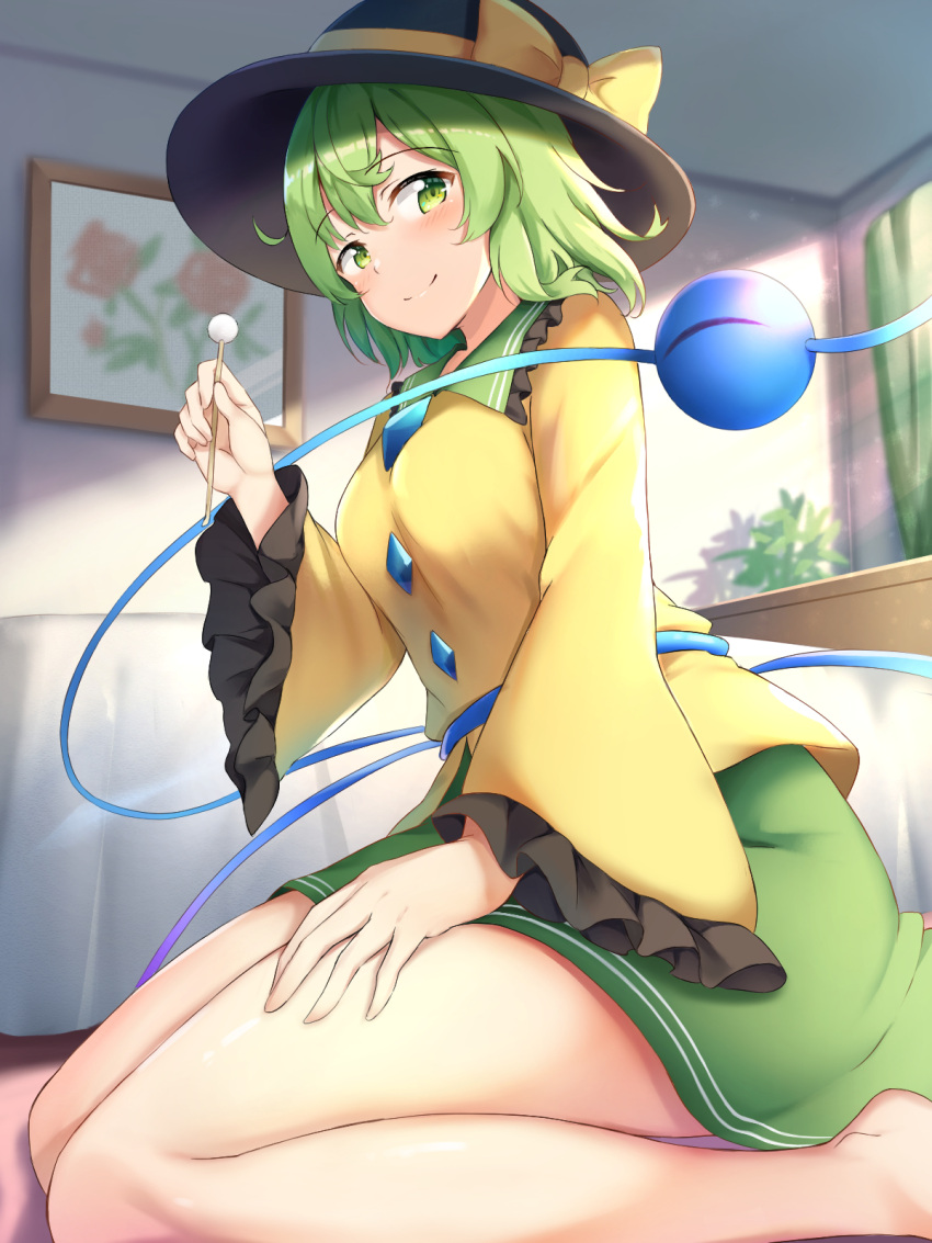 1girl black_headwear black_skirt closed_mouth commentary_request eyeball green_eyes green_hair hat highres holding komeiji_koishi long_sleeves looking_at_viewer nagomian shirt short_hair sitting skirt smile solo thighs third_eye touhou wariza yellow_shirt