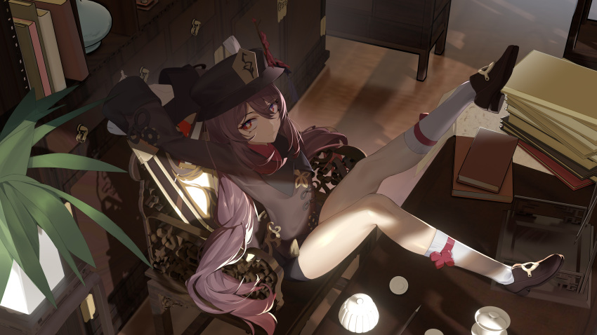 1girl absurdres black_headwear black_shorts book chinese_clothes collared_coat desk flower flower-shaped_pupils genshin_impact hat hat_flower highres hu_tao_(genshin_impact) indoors looking_at_viewer newflame plum_blossoms red_eyes red_flower scenery shorts sitting solo