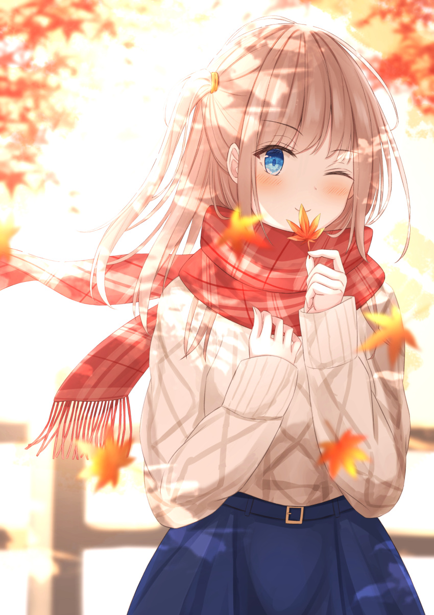 1girl ;) autumn_leaves bangs blue_eyes blue_skirt blurry blurry_background blush brown_hair closed_mouth commentary_request depth_of_field eyebrows_visible_through_hair fringe_trim highres holding holding_leaf leaf long_hair long_sleeves looking_at_viewer maple_leaf one_eye_closed one_side_up original plaid plaid_scarf red_scarf scarf senri_(senri_sen) skirt sleeves_past_wrists smile solo sweater white_sweater