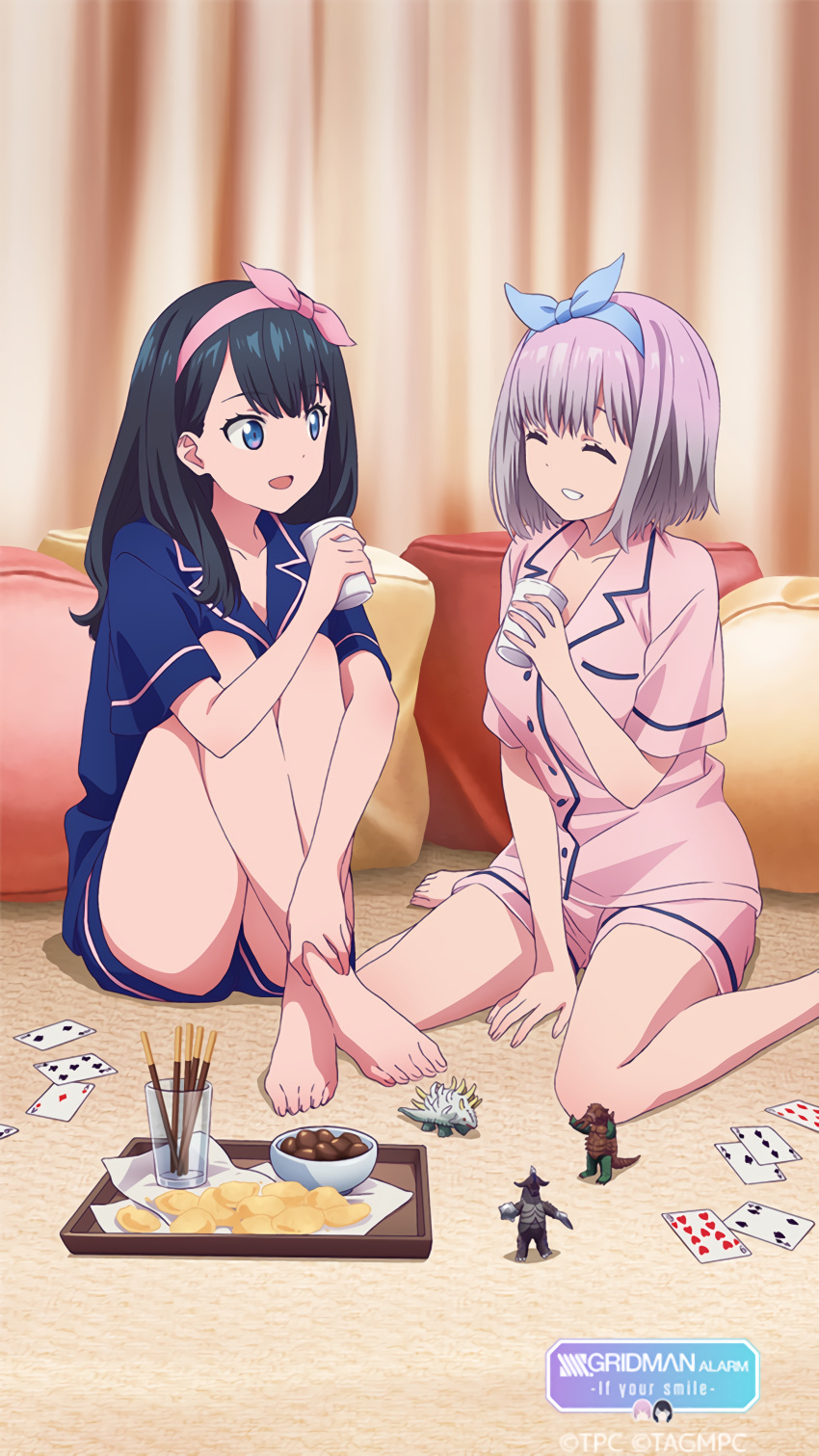 2girls :d ^_^ absurdres barefoot black_hair blue_eyes blue_pajamas breast_pocket card chips closed_eyes cup disposable_cup feet food full_body game_cg gridman_universe highres huge_filesize indoors multiple_girls official_art open_mouth pajamas pink_hair pink_pajamas pocket shinjou_akane sleepover smile ssss.gridman takarada_rikka