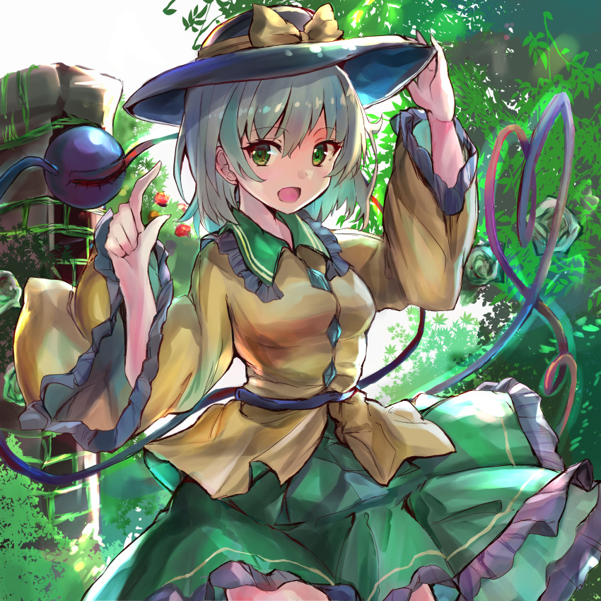 1girl absurdres breasts bush cropped_legs eyebrows_visible_through_hair frilled_shirt_collar frilled_skirt frilled_sleeves frills green_eyes green_hair green_skirt hair_between_eyes hand_on_headwear heart heart_of_string highres ikazuchi_akira index_finger_raised komeiji_koishi leaf long_sleeves looking_at_viewer medium_breasts open_mouth shirt short_hair skirt solo third_eye touhou tree upper_body wide_sleeves yellow_shirt