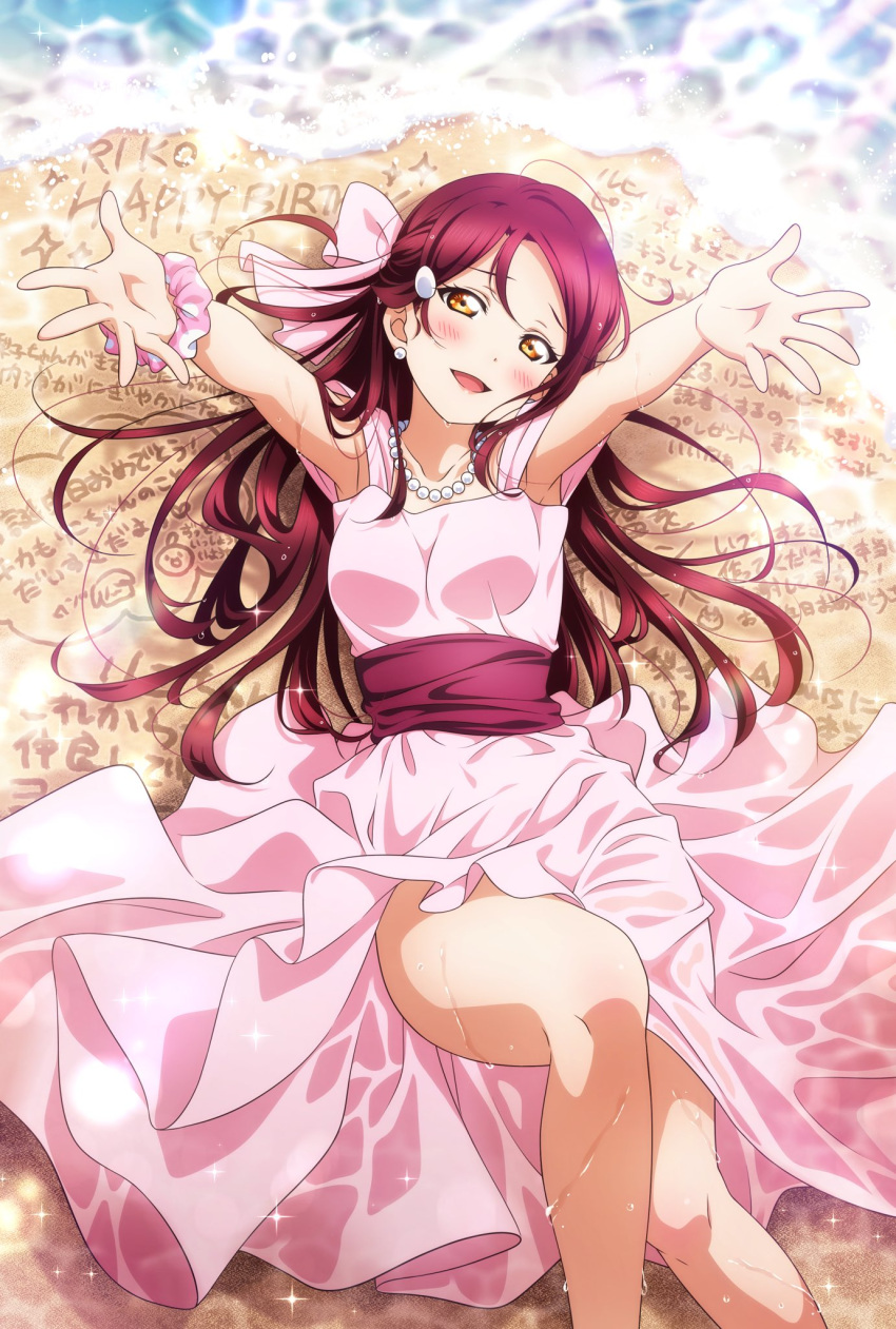 1girl bangs beach birthday blush breasts collarbone commentary dress earrings hair_ornament hair_ribbon happy_birthday highres jewelry kougi_hiroshi long_hair looking_at_viewer love_live! love_live!_sunshine!! lying necklace on_back pink_dress pink_scrunchie redhead ribbon sakurauchi_riko scrunchie small_breasts solo wet wet_clothes wrist_scrunchie yellow_eyes