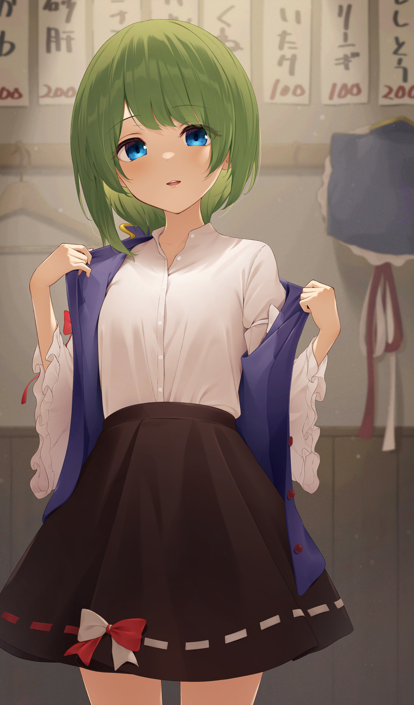 1girl asymmetrical_hair bangs black_skirt blue_eyes blue_headwear blue_vest blush breasts buttons clothes_hanger commentary_request cowboy_shot eyebrows_visible_through_hair eyes_visible_through_hair frills green_hair hair_between_eyes hat hat_removed headwear_removed highres indoors juliet_sleeves kanpa_(campagne_9) light_particles light_smile long_sleeves looking_at_viewer parted_lips puffy_sleeves shiki_eiki shirt short_hair skirt small_breasts solo standing touhou undressing vest white_shirt wide_sleeves