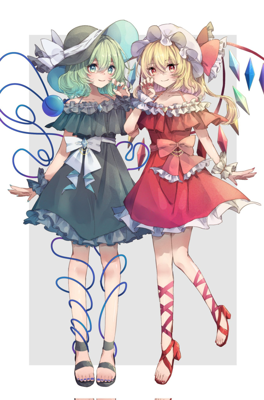 2girls adapted_costume aqua_eyes bangs bare_shoulders blonde_hair border bow claw_pose closed_mouth collarbone commentary_request crystal dress eyebrows_visible_through_hair flandre_scarlet frilled_bow frills full_body green_dress green_hair grey_background hair_between_eyes hand_up hat hat_bow heart heart_of_string highres komeiji_koishi looking_at_viewer medium_hair mob_cap multiple_girls nail_polish off-shoulder_dress off_shoulder one_side_up outside_border petticoat re_re_merry red_bow red_dress red_eyes red_nails smile standing standing_on_one_leg third_eye toenail_polish toenails touhou white_border white_bow white_headwear wings wrist_cuffs