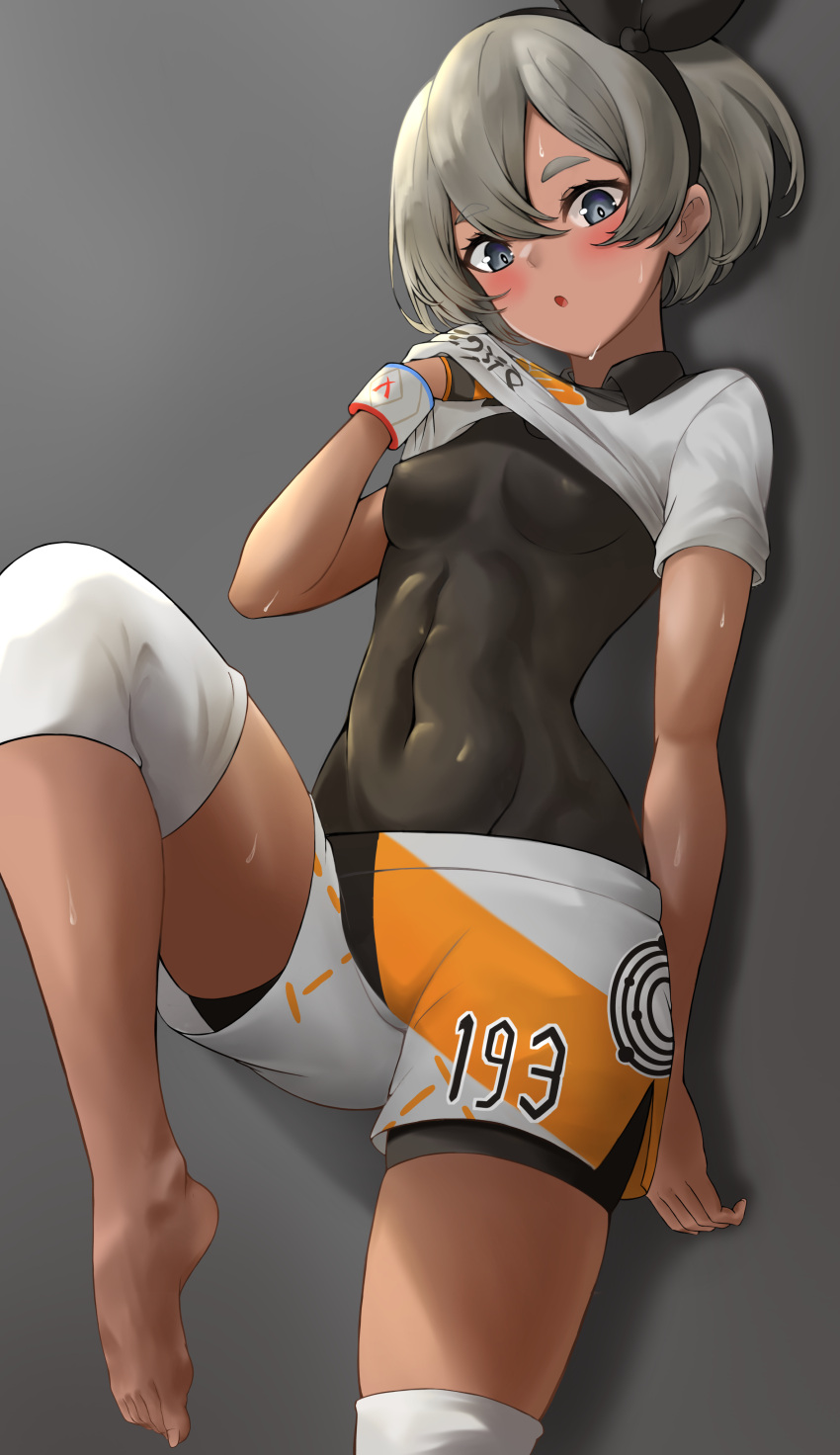 1girl absurdres bangs barefoot bea_(pokemon) black_bodysuit black_hairband blush bodysuit bodysuit_under_clothes bow_hairband breasts collared_shirt commentary_request covered_abs covered_navel dark_skin dstwins97 dynamax_band gloves grey_background grey_eyes grey_hair hair_between_eyes hairband hand_up highres knee_pads leg_up looking_at_viewer pokemon pokemon_(game) pokemon_swsh print_shirt print_shorts shirt short_hair short_sleeves shorts side_slit side_slit_shorts single_glove solo sweat toes